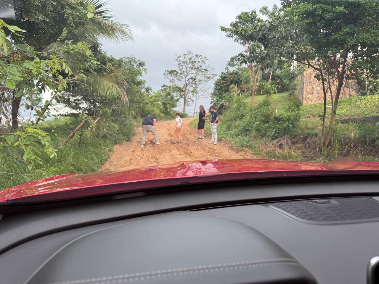 Patching up the muddy road in Roatan