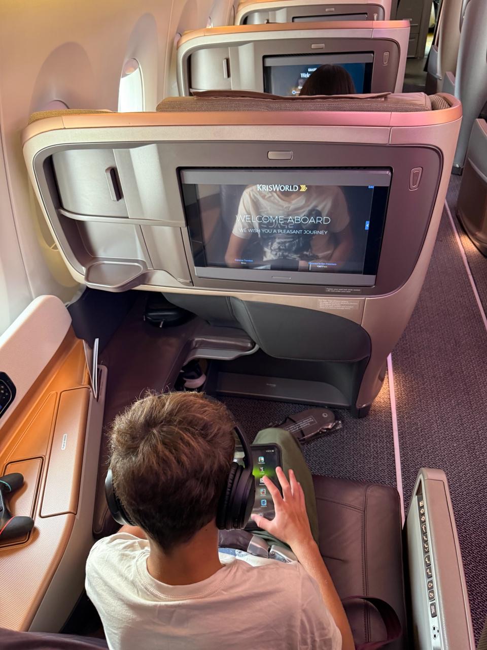 Kids enjoying in-flight entertainment