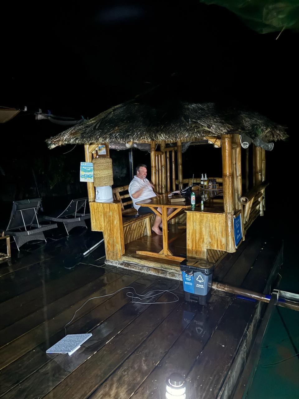 Jonathan working from a hut in the Philippines with Starlink Mini