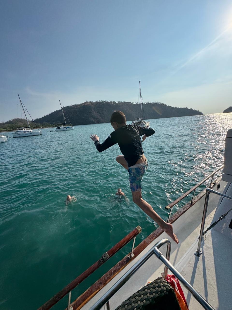 Jumping off the boat into the Pacific