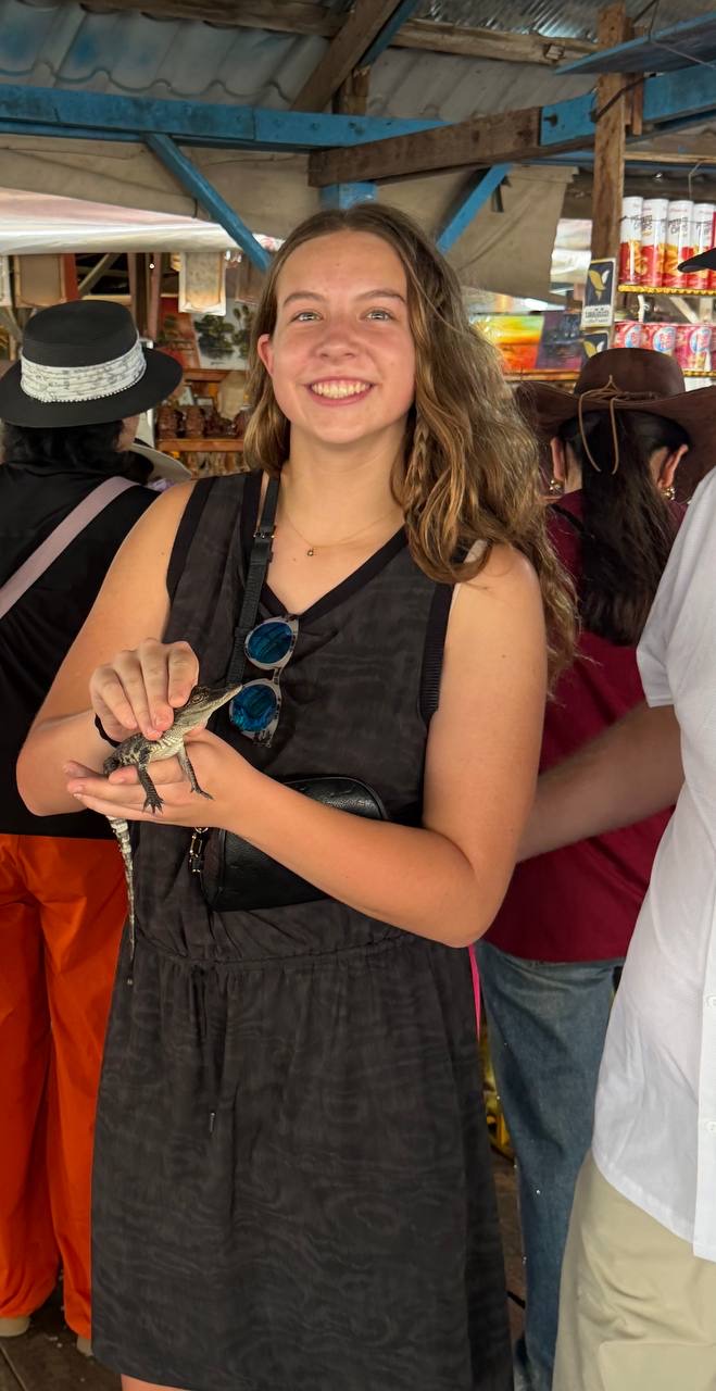 Abbey holding a baby crocodile