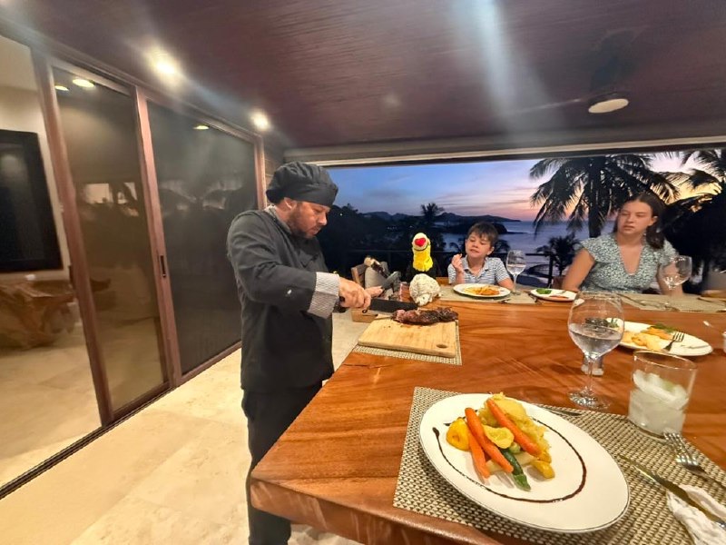 Chef Hugo carving steak for dinner